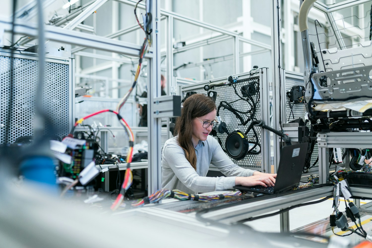 Technician inspecting electronic control equipment